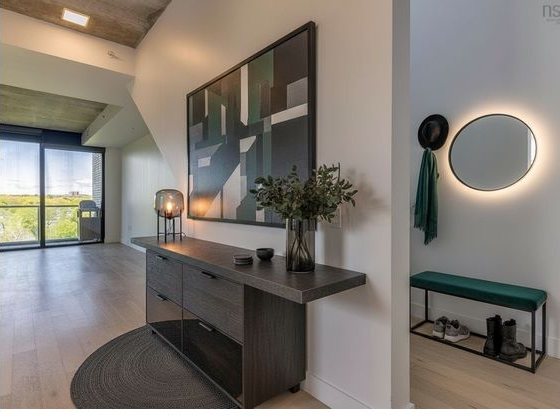The staged render: the staircase has been replaced by a flat wall with a mirror.
