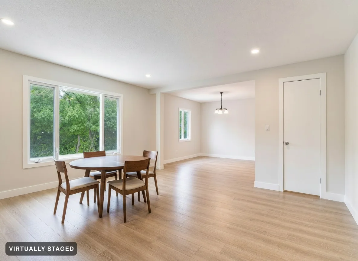 The same space with a round walnut dining table and four chairs added by the window, exactly as asked