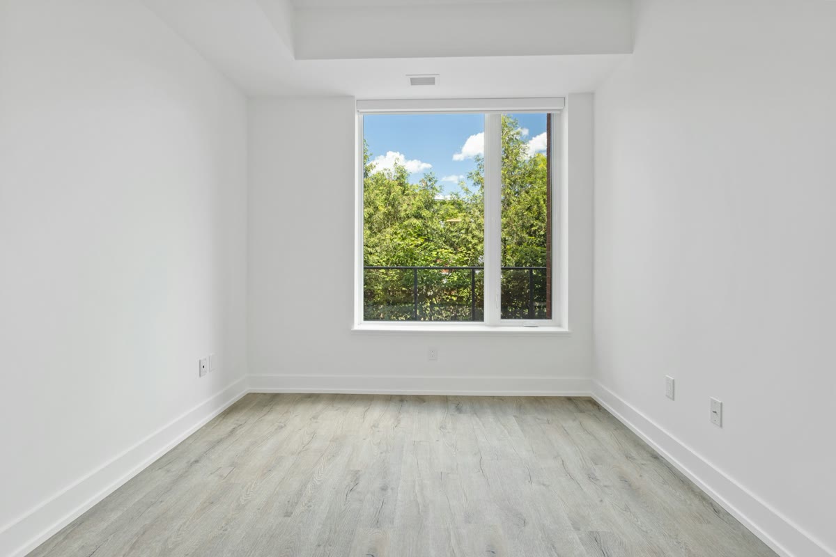 Empty room with grey wood flooring