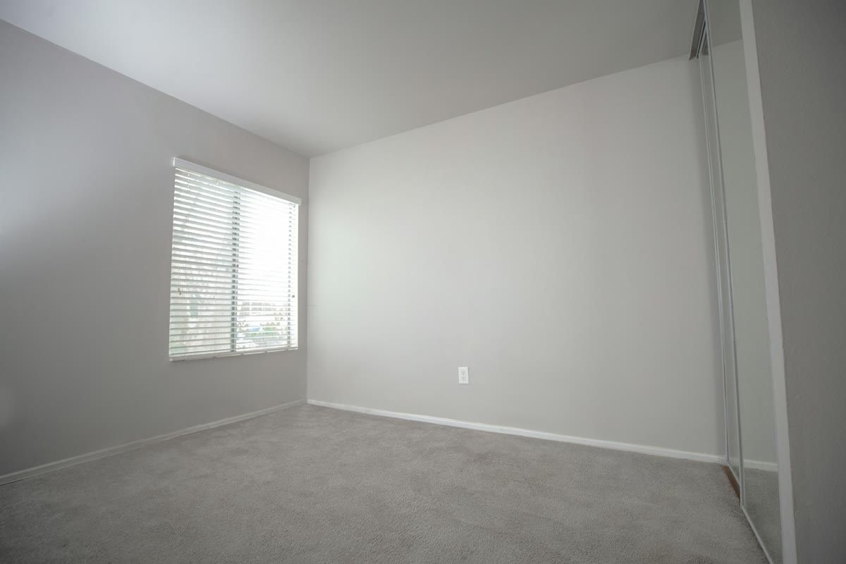 Empty carpeted room, as photographed