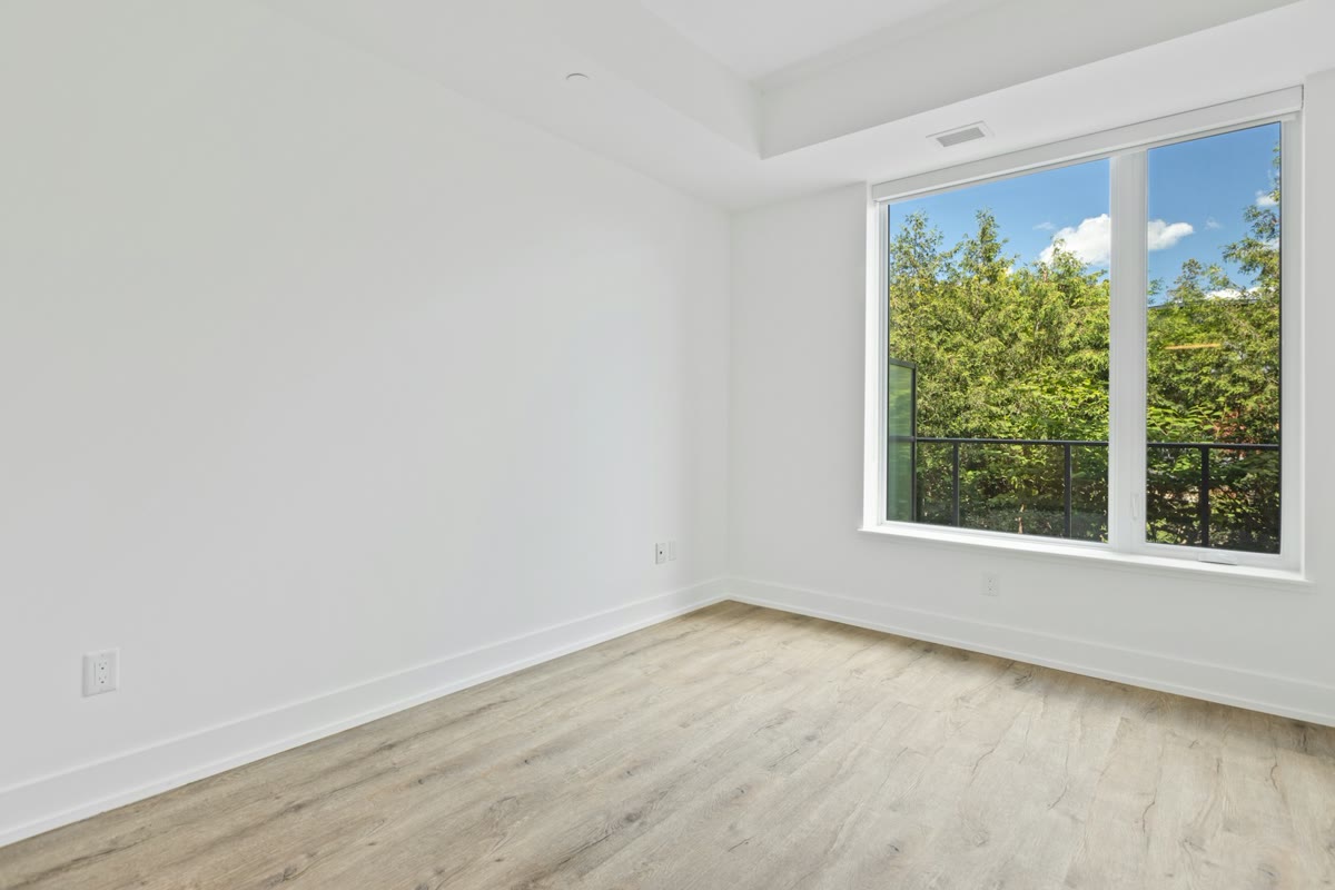 Bright empty room with a large window, as photographed